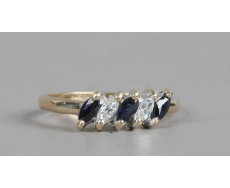 A 9ct gold ring set with sapphires and white paste stones, size M.