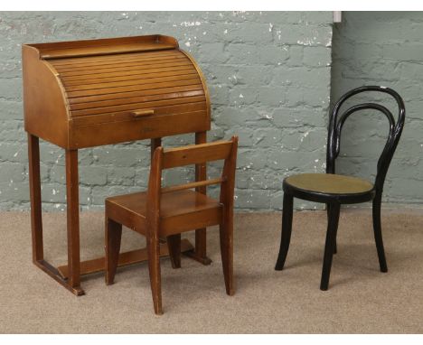 A childs swallow roll top desk (light damage) and chair, along with a childs Bentwood chair.