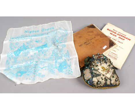 A collection of war related memorabilia The World War in maps, silk nippon times unconditional surrender by Japanese and a de