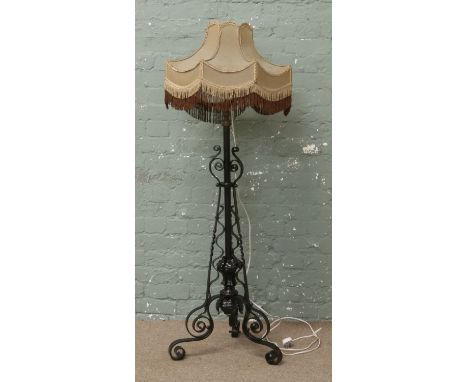 An iron work rise and fall standard lamp.