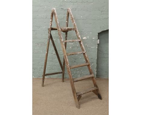 A pair of wooden step ladders.