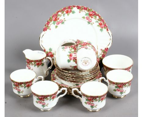 A Royal Stafford bone china part tea service in the 'Olde English Garden' pattern including cups and saucers, side plates, mi