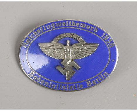 A World War II German Third Reich NSFK oval enamel badge, makers stamp for Rob Neff Berlin.