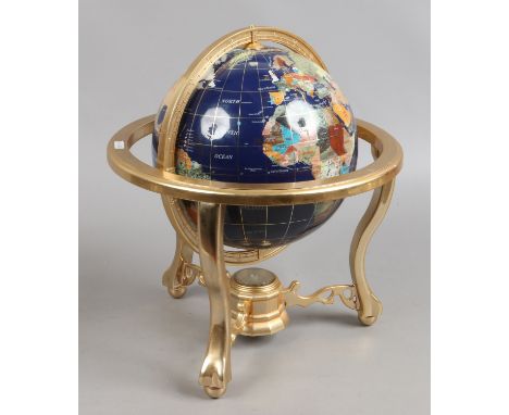 A 360 rotating hardstone globe on stand with in built compass.