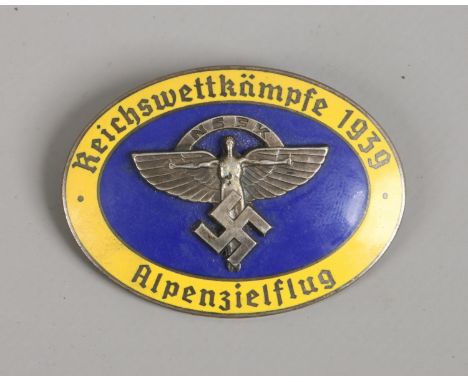 A World War II German Third Reich NSFK oval enamel badge, makers stamp for Ges Gesch.