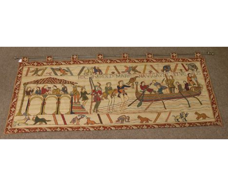 A modern machined woolwork tapestry on rail after the Bayeux tapestry.