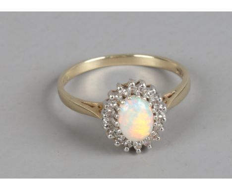 A 9ct gold opal and diamond ring, size O.