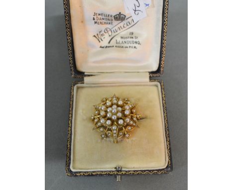 A 15ct. Gold Pearl Set Brooch in the form of a Star