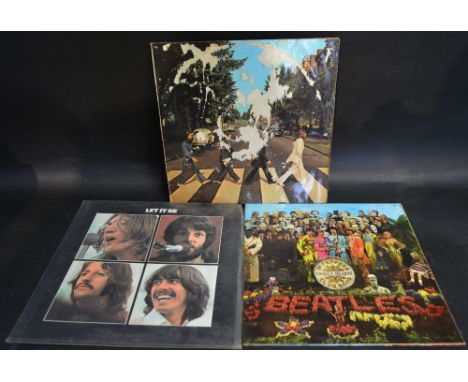 An Original Vinyl Album 'Sgt. Peppers Lonely Hearts Club Band' by The Beatles, together with another 'Let It Be' and another 