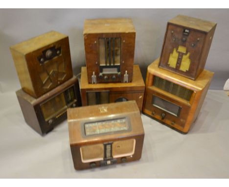 A 'His Master's Voice' Walnut Cased Early 20th Century Radio, together with six other similar early radios