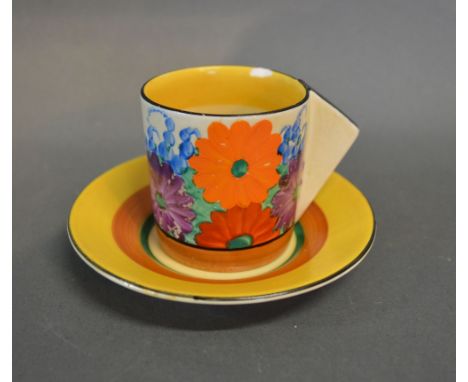 A Clarice Cliff Bizarre Coffee Can and Saucer (a/f)