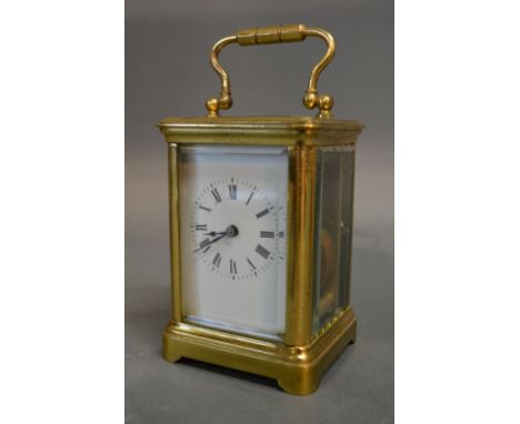 A 19th Century French Brass Cased Miniature Carriage Clock, the enamel dial with Roman numerals and with lever escapement, 8c