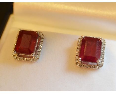 A Pair of 18ct. White Gold Treated Ruby and Diamond Stud Earrings, ruby approximately 10.75 ct.