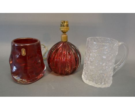 A Whitefriars Ruby Glass Knobbly Vase together with a Whitefriars Bark Pattern Mug and a Cranberry Glass Lamp of globular ree