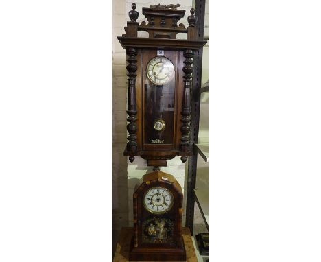 A Mahogany Vienna Wall Clock, signed to the dial, approximately 100cm high, also with a Victorian American mantel clock, (2) 