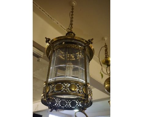 A Brass Hall Ceiling Lamp, circa late 19th century, Of cylindrical form, Decorated with roundels, glazed, approximately 58cm 