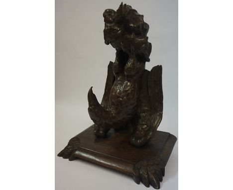 A Continental Carved Oak Wall Bracket, circa 19th century, Modelled as an eagle holding a hare in its talons, 42cm high
