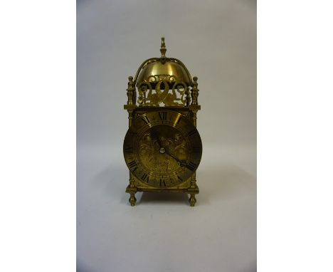 A 17th Century Style Brass Lantern Clock, with key, 31cm high