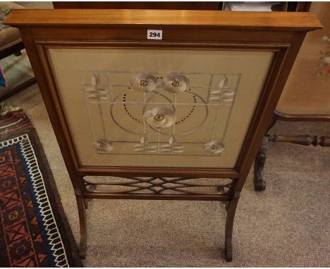 A Mahogany Firescreen, circa early 20th century, Having an Arts &amp; Crafts style embroidered stylised floral panel on silk,