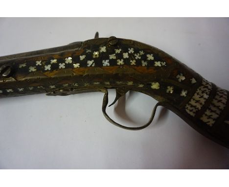 An Indian Percussion Musket, circa 19th century, The butt and stock decorated with mother of pearl, with metal ramrod and sho