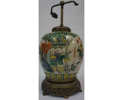 A Chinese Oviform Famille Verte Vase, circa late 19th century, Converted to a table lamp, decorated with panels of a flying d