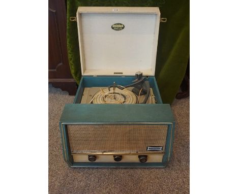 A Dansette "Conquest Auto" Record Player, circa 1960s, Having a Monarch turntable, in a teal and cream finish, 49cm long