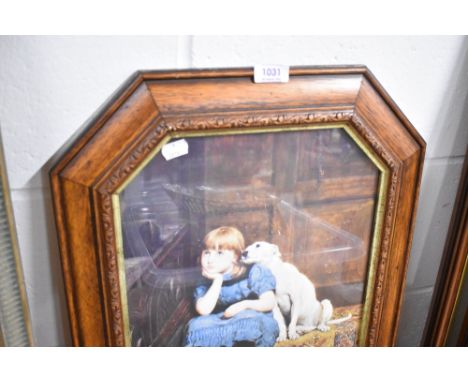 A framed print of a girl sat with dog