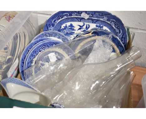 A selection of blue and white wear ceramics and glass oil lamp chimneys