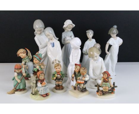 Selection of Lladro Nao figurines to include dancing girl, girl with puppy, girl with blanket, children with candle together 