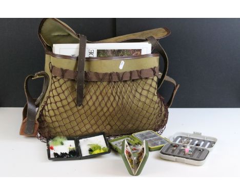 Fishing tackle bag containing flies and reels together with an Orvis fishing guide and other related books, etc