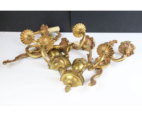 Pair of urn topped wall sconce light fittings with double branches together with a pair of gilt metal wall sconce light fitti