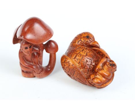 Two carved wood netsuke figures to include bird with baby monkey (signed) and a monkey sat in mushroom plants 