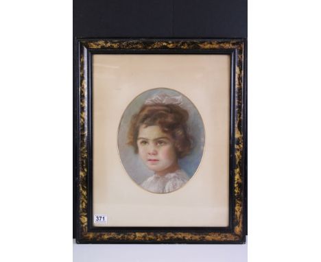 Early 20th century English school, oval portrait of a young girl with ribbon in her hair, pastel, 30 x 25cm, framed and glaze