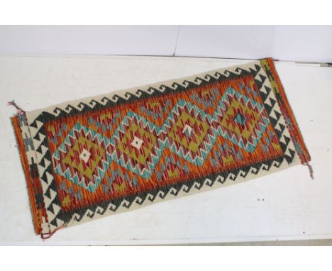 Chobi Kilim runner rug with woven geometric design. Measures 146 x 62cm. 