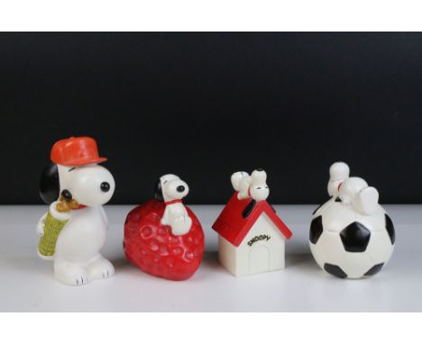 20th century vintage ceramic Snoopy money box figurines to include Snoopy on giant strawberry, Snoopy on kennel, Snoopy on fo