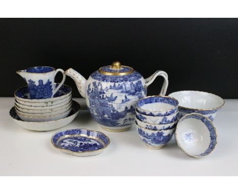 Blue and white Chinese tea set with landscape decorations, ornate border and gilt finish comprising of a cross handle tea pot