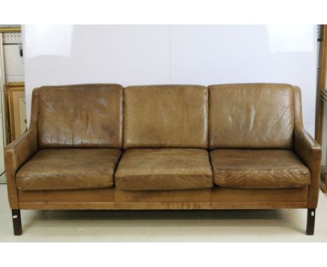 1970's Mogensen settee sofa raised on square leg supports, upholstered in brown leather, H 73cm W 175cm D 73cm