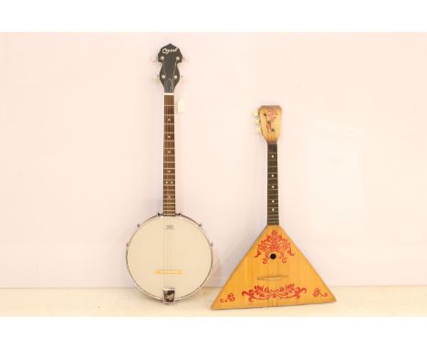 Russian three string balalaika with hand painted detail together with an Ozark four string open back tenor banjo