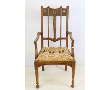 Early 20th century oak Art Nouveau style open armchair, upholstered in Liberty Ianthe pattern fabric, 116cm high x 58cm wide 