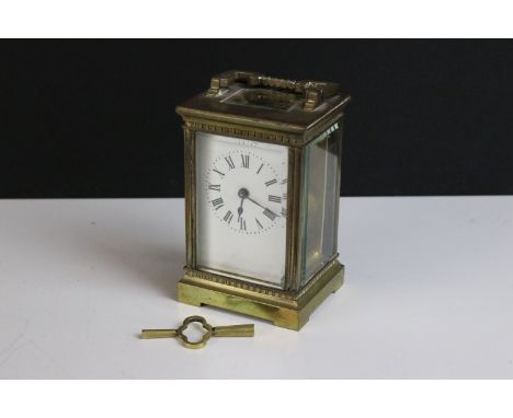 Early 20th century brass carriage clock with handle H 11.5cm, W 7.5cm, D 6.5cm