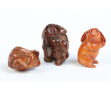 Three miniature wood netsuke figures to include monkey, Chinese dragon and a signed rabbit