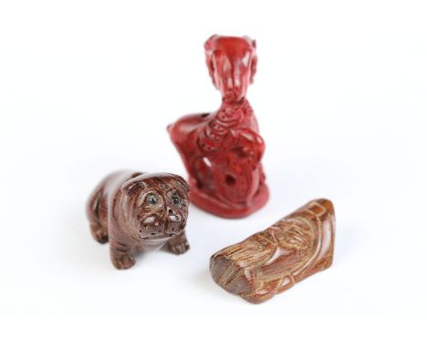 Three miniature wood netsuke figures to include bulldog, money goat and face of a wise old man