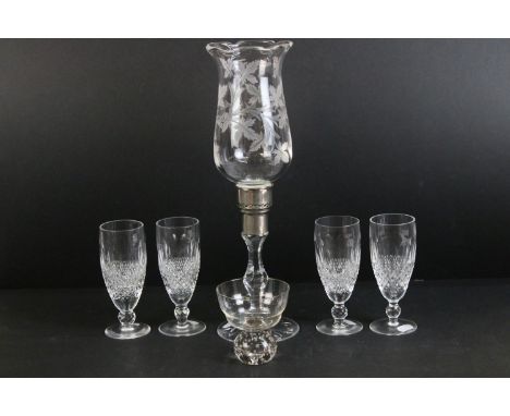 Set of four Waterford crystal champagne flutes, H 15cm together with a mid century dessert glass with bubble stem, H 10cm and