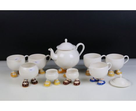 Carlton ware 'Walking Ware' part breakfast set to include four 'footed' cups, tea pot, milk jug, sugar bowl and two egg cups