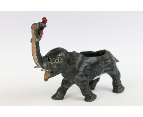 A French spelter ink pen nib cleaner modelled as a elephant with young boy climbing trunk. 