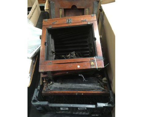 CARTON WITH REMNANTS OF WOODEN VINTAGE BELLOWS CAMERA