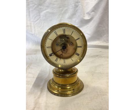 SMALL BRASS TABLE CLOCK ON PEDESTAL