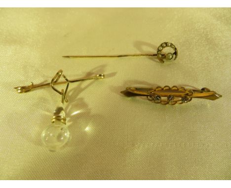 A vintage YM Holy Water brooch, a Victorian YM seed pearl stick pin (one pearl missing), and one other brooch.