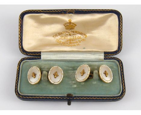 A fine pair of 18 carat gold, white enamel and Mother of Pearl cufflinks, marked 18ct, circa 1920, each side approx 16 x 12mm