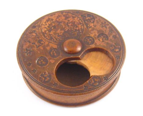 Treen. An 18th. century boxwood snuff box, the swivel lid with thumb holes and impressed decoration of St. George and Dragon 